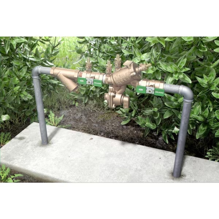 Brass Zurn Wilkins reduced-pressure (RPZ) backflow preventer installed above ground on a residential irrigation line in Ponte Vedra Beach, FL